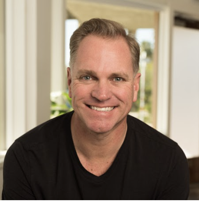 Tom Dougherty black shirt